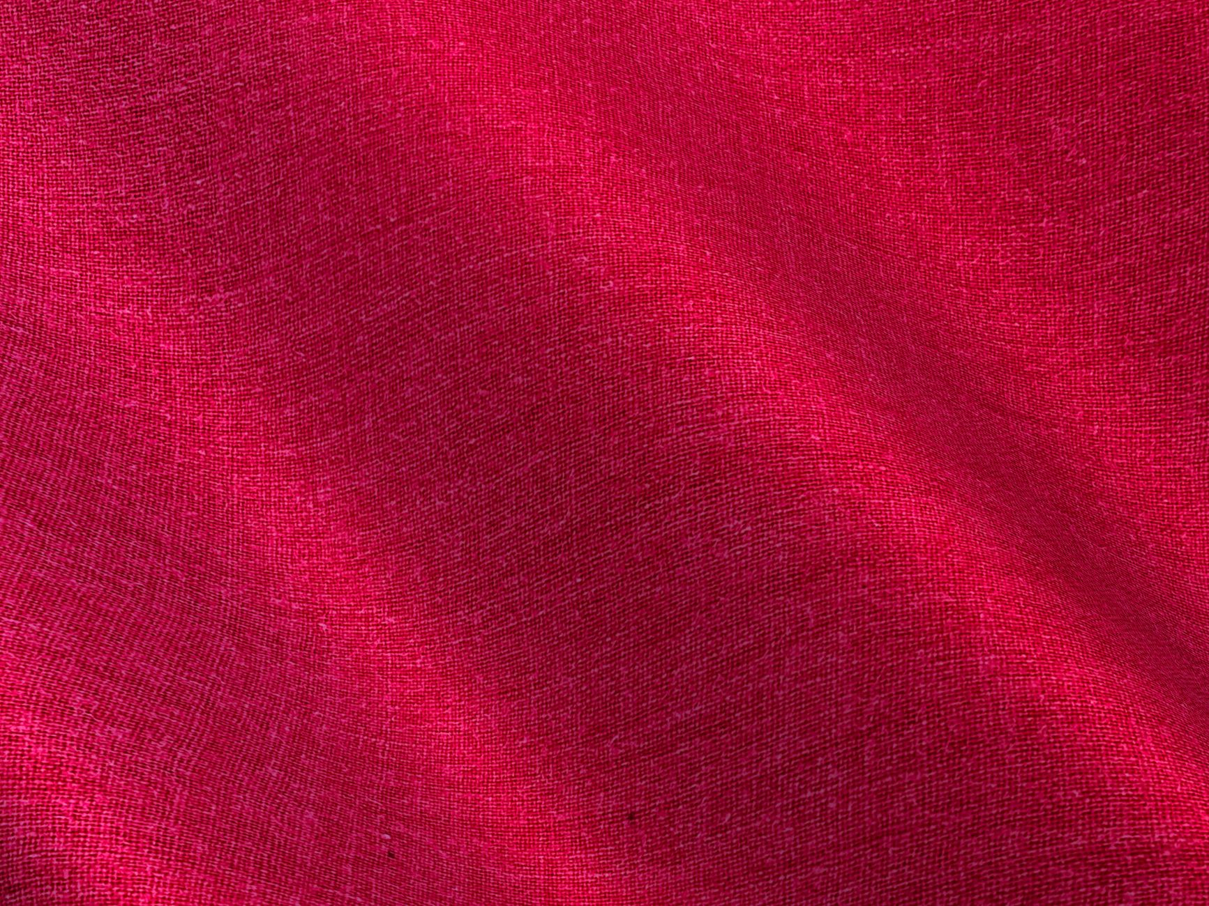 Close-up of linen tailored separates fabric texture showing natural weave in sage green