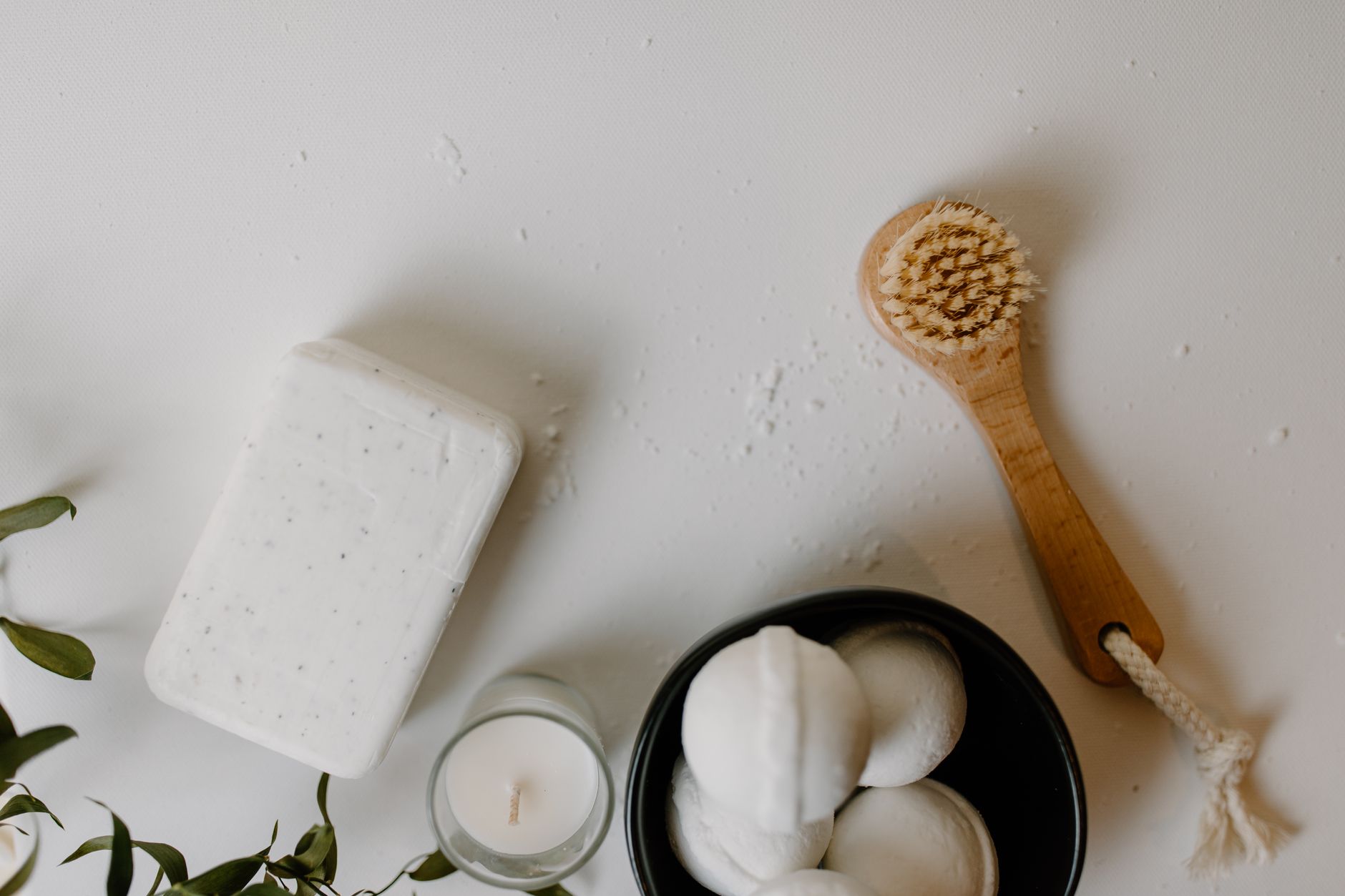 Flatlay of traditional skincare ingredients UK beauty lovers are rediscovering including rose hip oil and botanical extracts