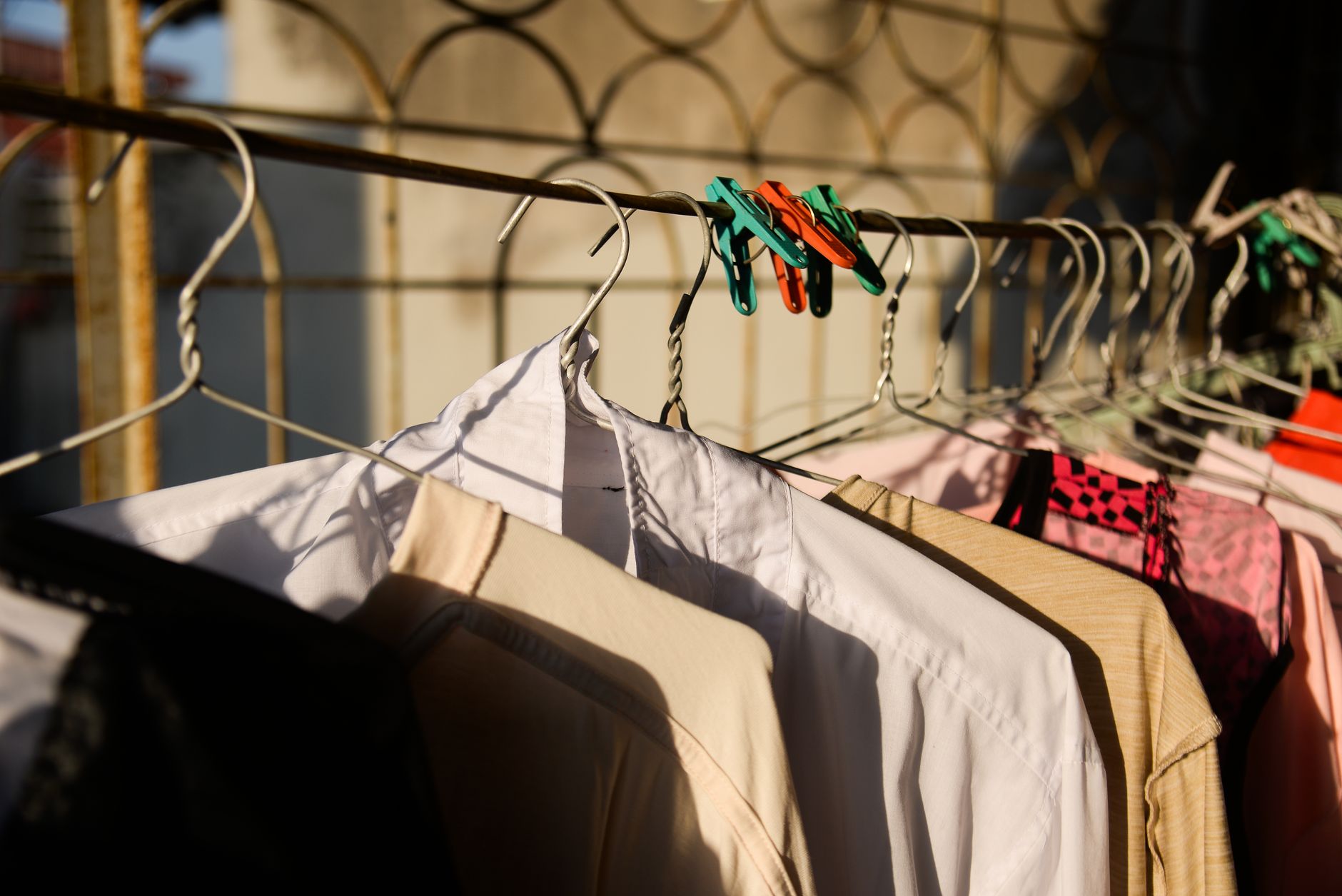 Organised rail of sustainable natural-fibre clothing illustrating sustainable fashion standards UK 2026