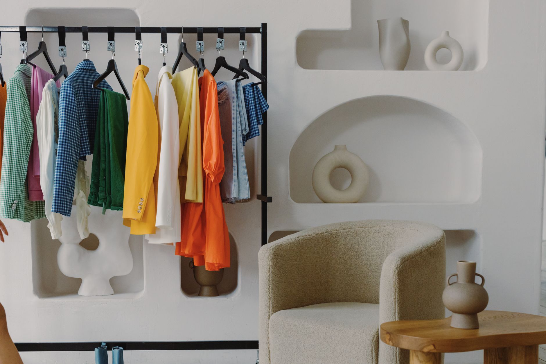 Colour drenching in deep sage green applied throughout a compact British dressing room